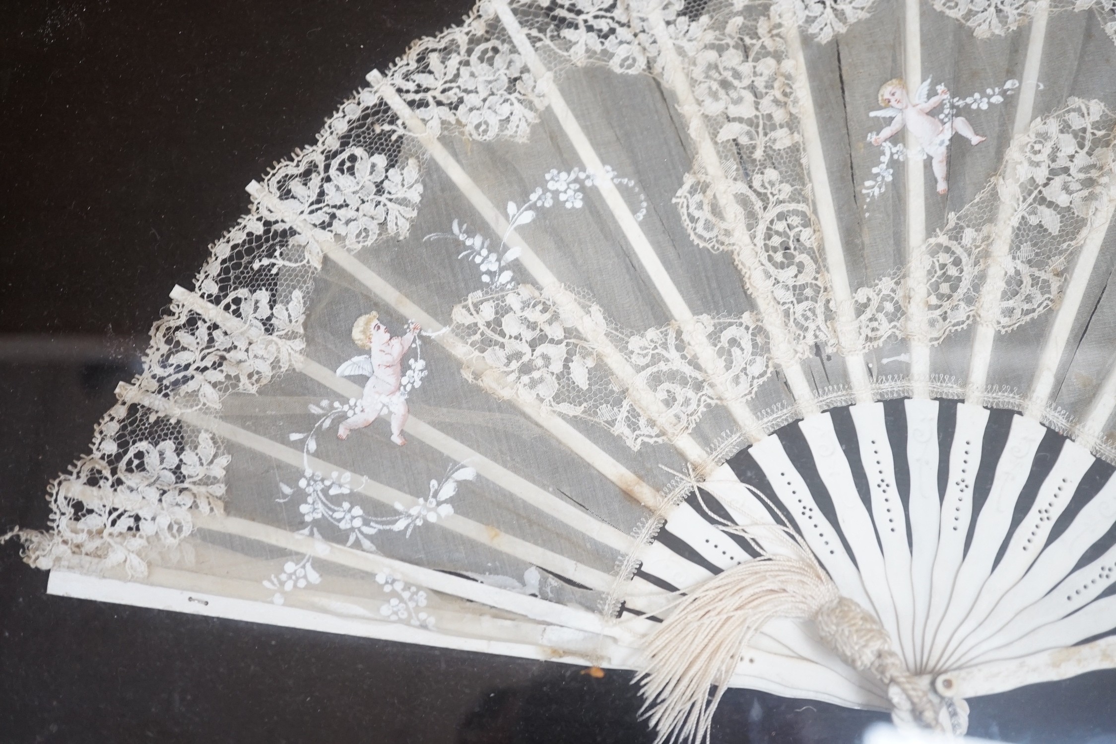 A pair of 19th century cased bone and painted lace fans, 40cm long excl frame